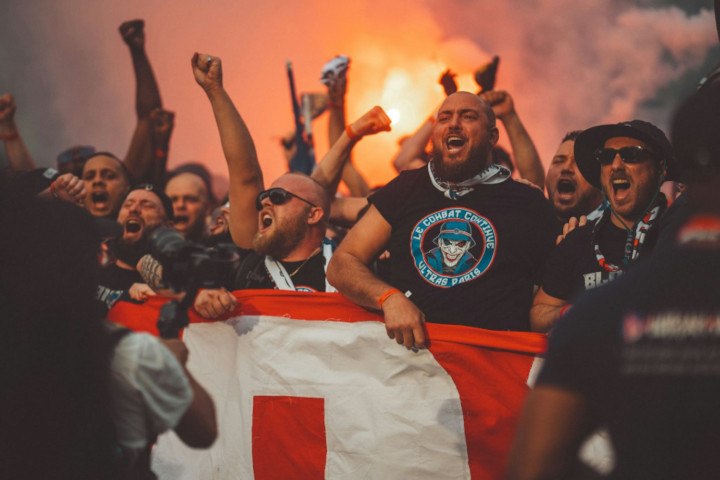 Football Fans Supporting Their During the Match